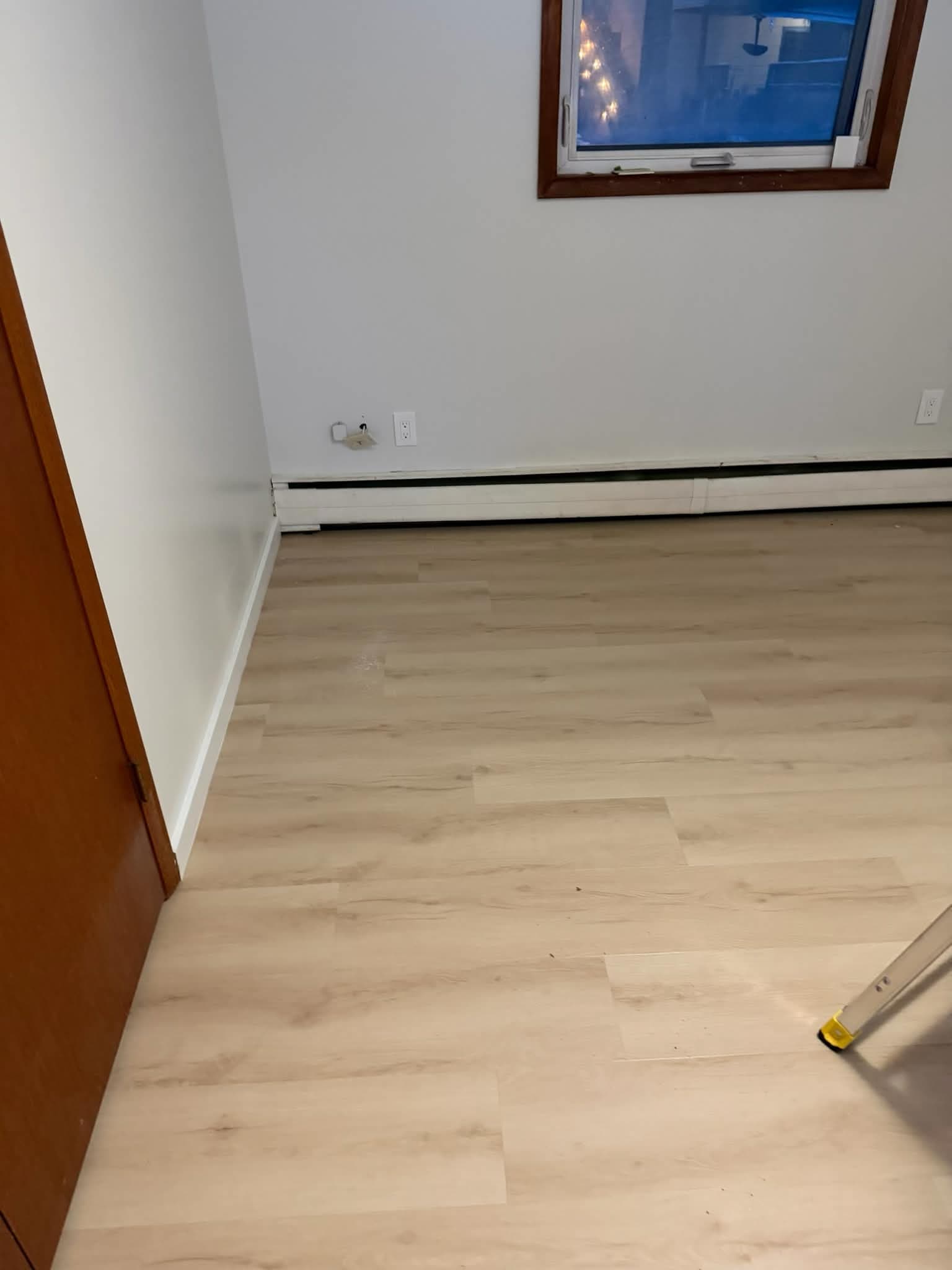 LVP flooring in bedroom with window