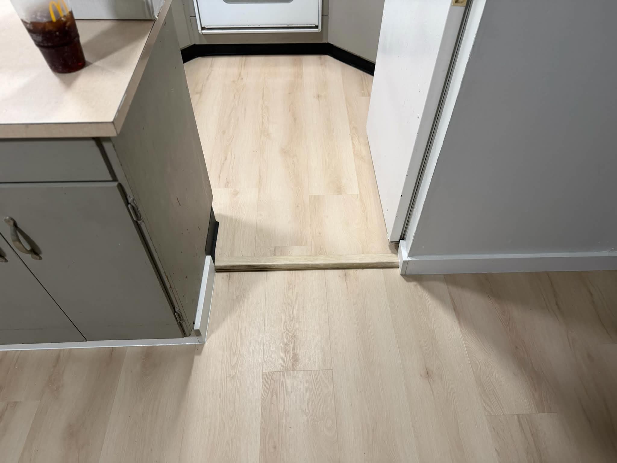 LVP flooring between kitchen appliances