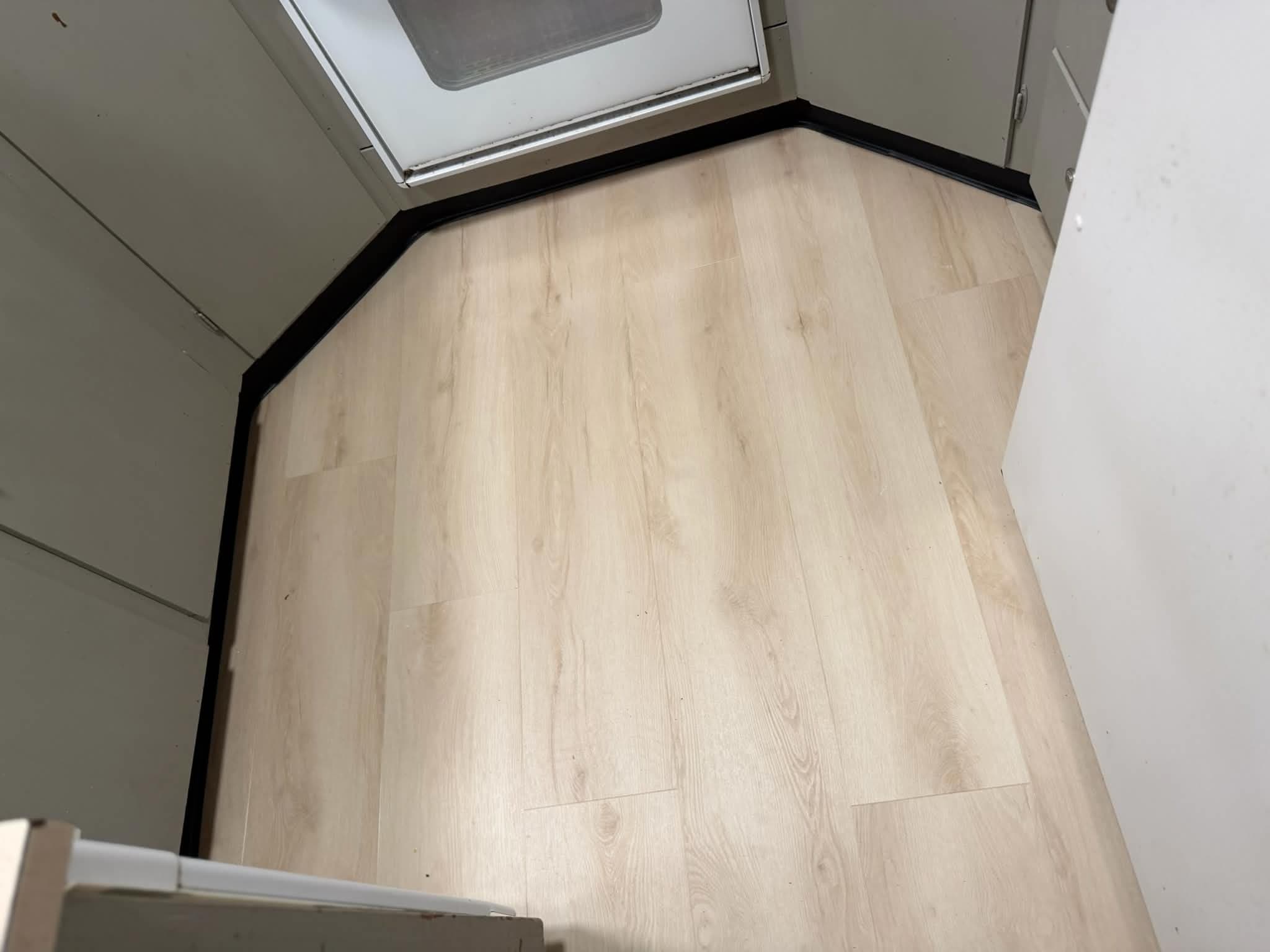 LVP flooring in kitchen near oven