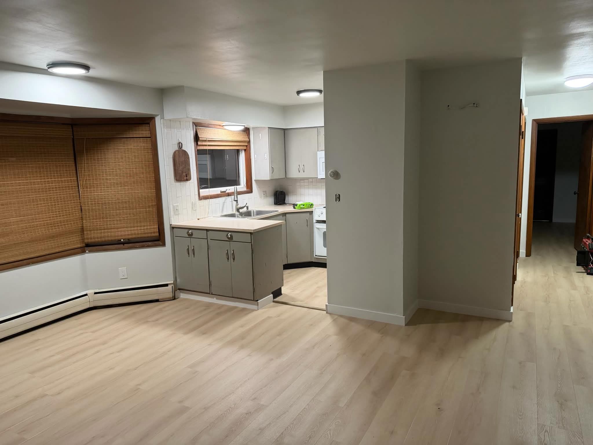 LVP flooring kitchen and living area, alternate angle