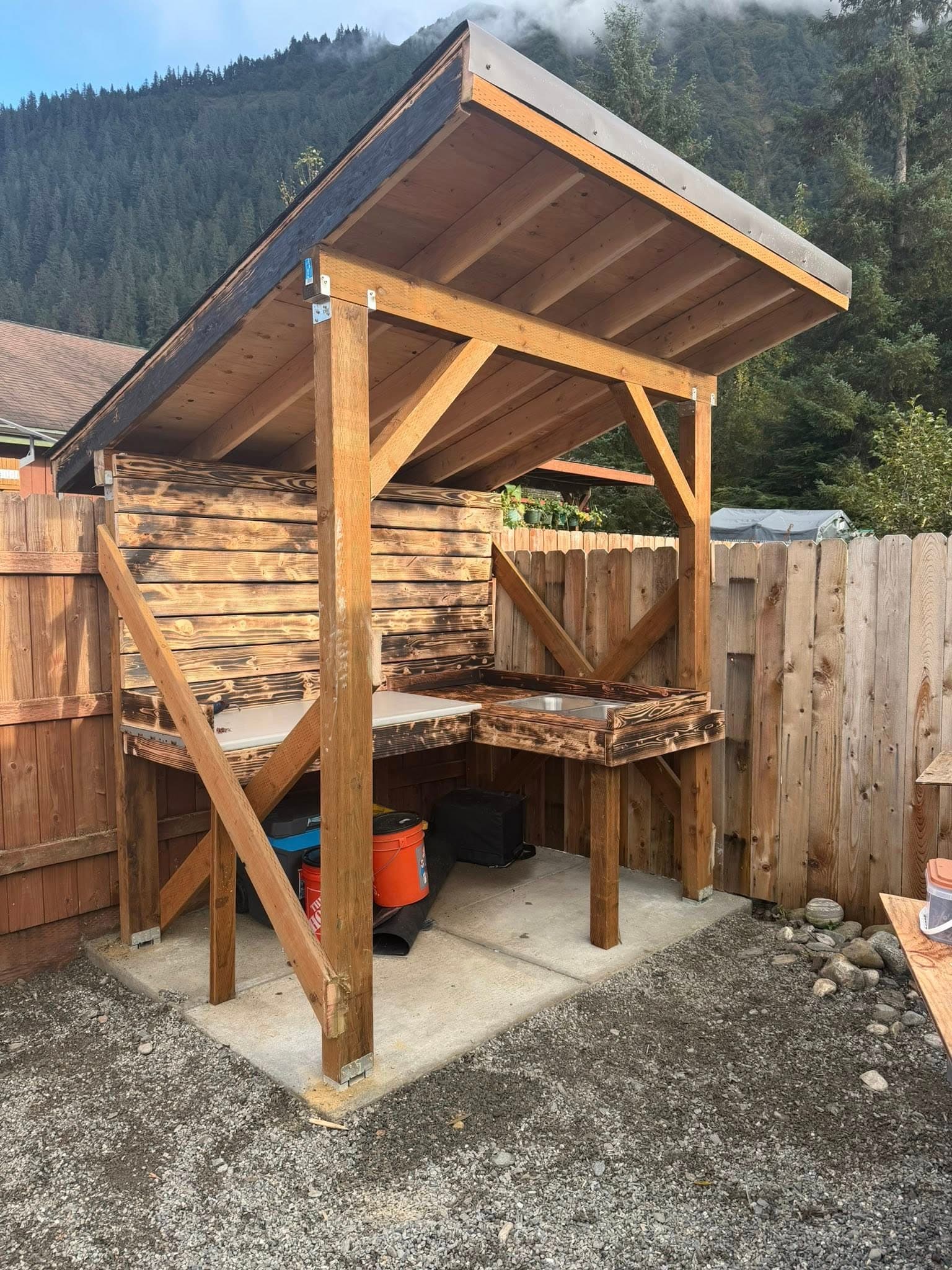 Custom covered outdoor work shelter built by Sourdough Construction, Juneau Alaska